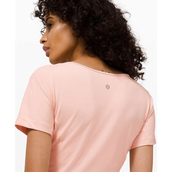 (4) $68 Lululemon Nulu Cropped Slim Yoga Short Sleeve Pink Mist - Picture 4 of 8